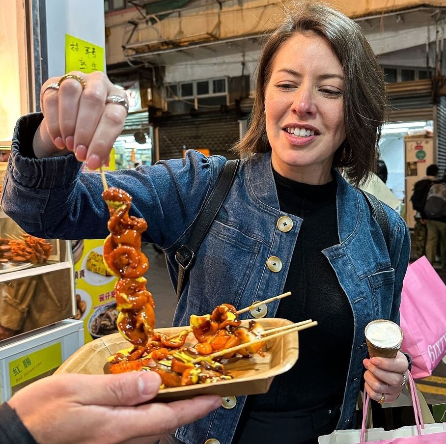 Sofia Levin having a Hong Kong street snack.