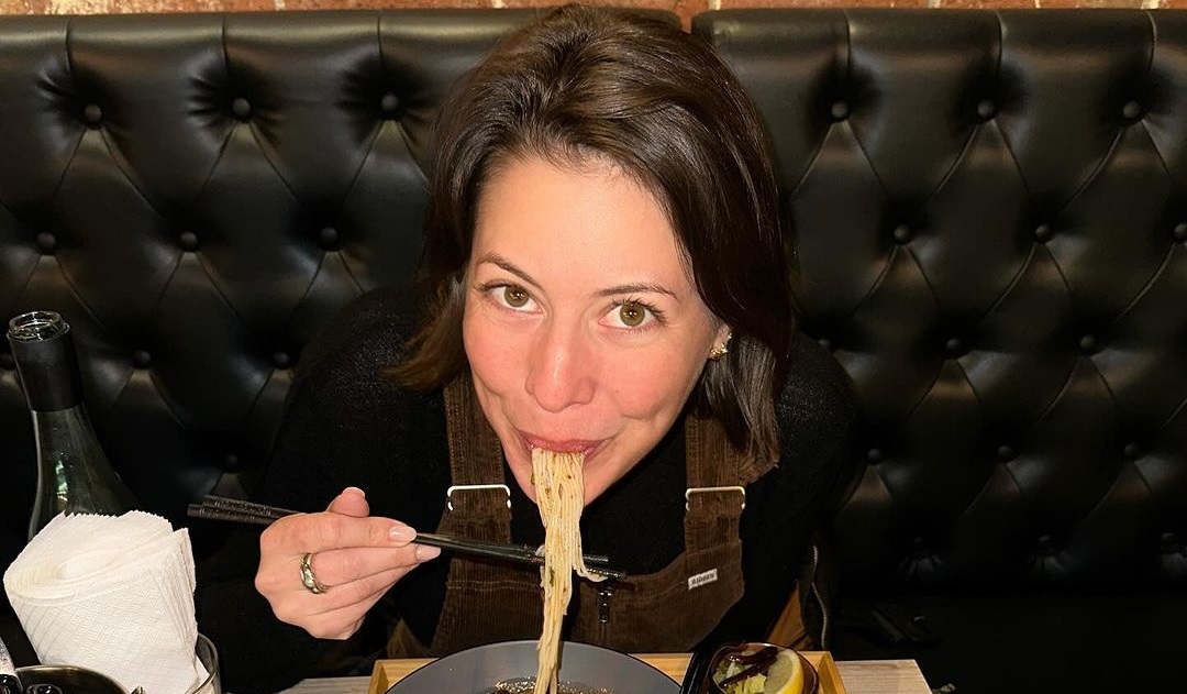 Sofia Levin enjoying noodles with a chopstick